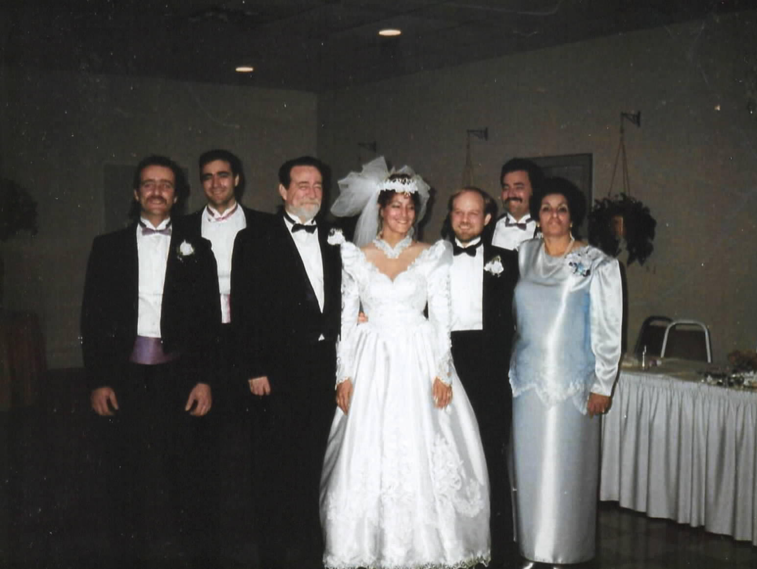 David and Andrea in a group wedding portrait